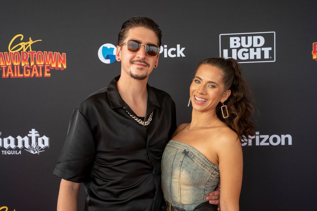 Guy Fieri's son Hunter Fieri with Tara Bernstein arrives at Guy Fieri's Flavortown Tailgate Party at Mardi Gras World on February 9, 2025 in New Orleans, Louisiana