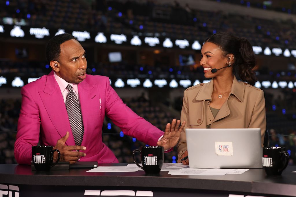 ESPN commentators Stephen A. Smith (L) and Malika Andrews report before Game Three of the 2024 NBA Finals