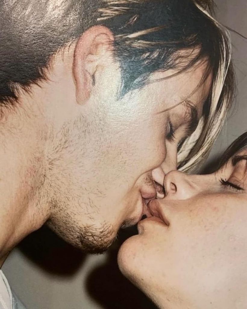 A close-up of David and Victoria Beckham kissing with their eyes closed