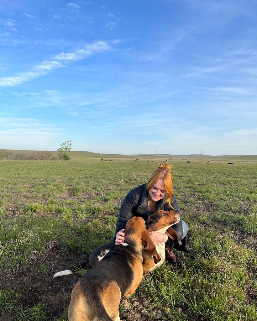 Ree Drummond with her dogs on her land in Oklahoma