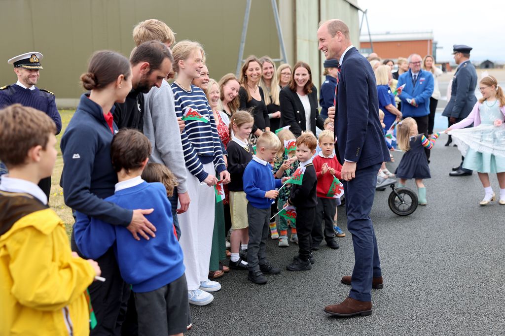 Prince William talks to members of the public during an official visit at RAF Valley