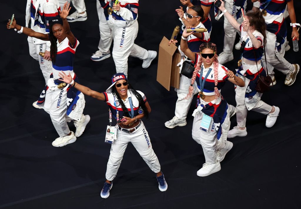 Long jumper Tara Davis-Woodhall and footballer Trinity Rodman of Team United States wave to the crowd during the Closing Ceremony of the Olympic Games Paris 2024 at Stade de France on August 11, 2024 in Paris, France.