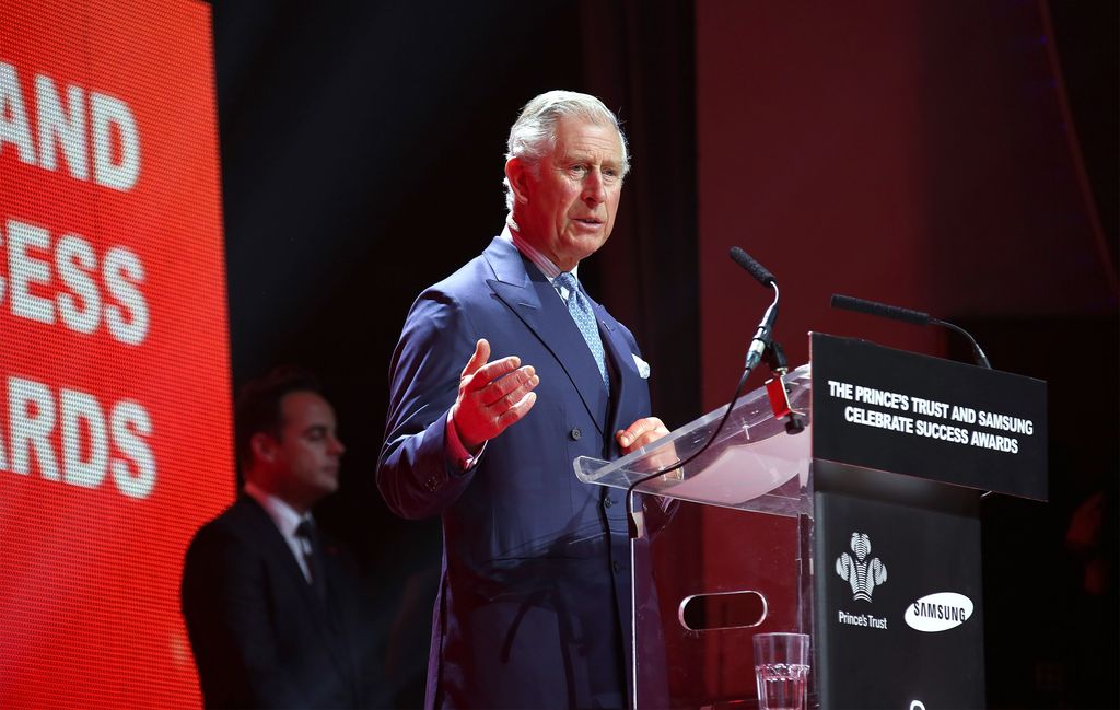 charles delivering speech at awards ceremony