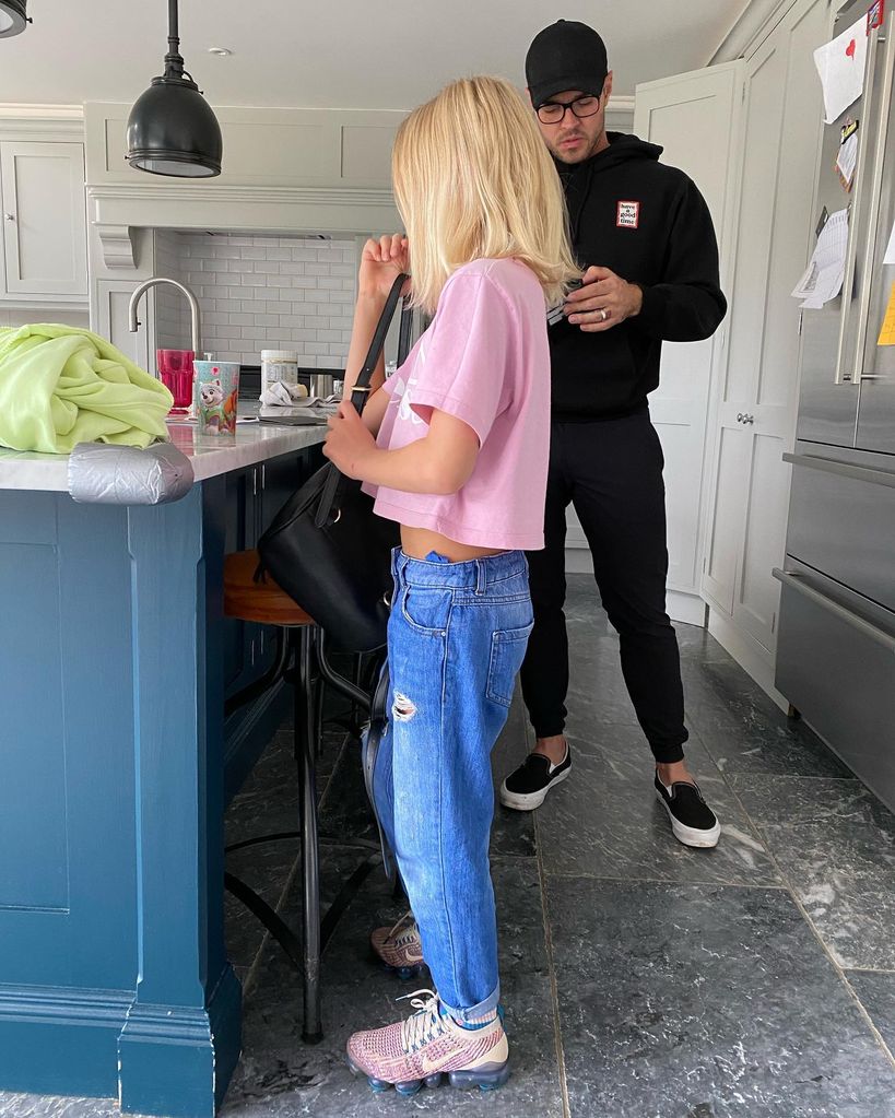 father and son stood in kitchen