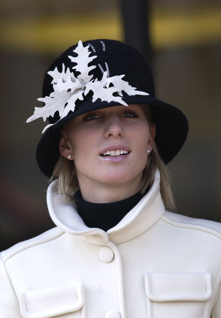 Zara Phillips wearing black hat with big white flowers on