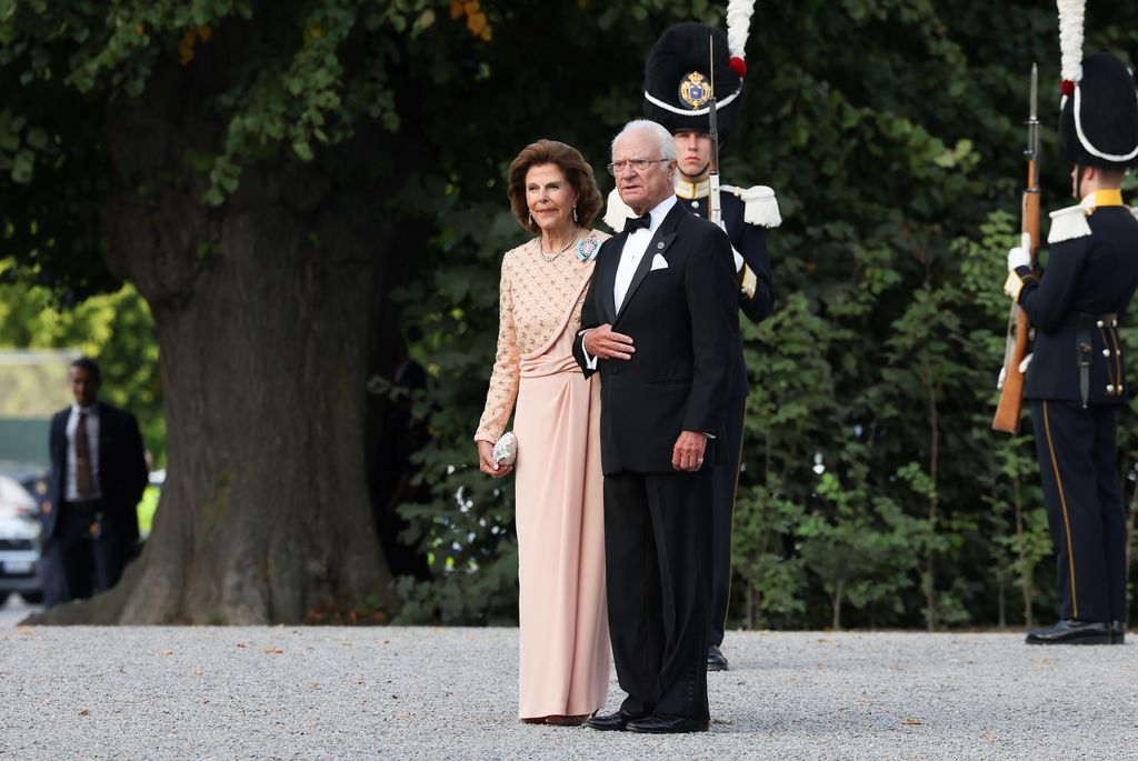 Queen Silvia and King Carl XVI Gustaf of Sweden arrive to the Royal Swedish Opera's jubilee performance at Drottningholm Palace Theatre