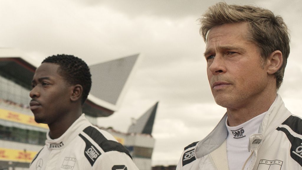 Damson Idris as Joshua Pearce and Brad Pitt as Sonny Hayes in Apple Original Films’ “F1 The Movie,” now in cinemas and IMAX.