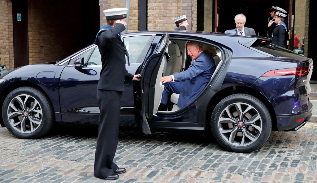King Charles gets into his new chauffeur driven Jaguar I-PACE fully electric car following a visit to the newly refurbished 'Maiden' Yacht at HMS President on September 5, 2018