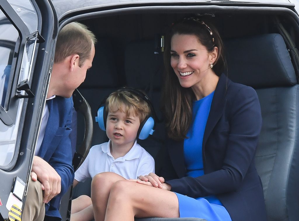 Catherine, Duchess of Cambridge, Prince George of Cambridge and Prince William, Duke of Cambridge sit in a helicopter as they attend the The Royal International Air Tattoo at RAF Fairford on July 8, 2016