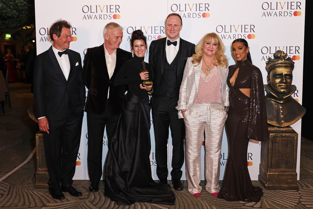 Presenters Dominic West (L) and Freema Agyeman (R) pose in the winners room with winners of the Best New Entertainment or Comedy play for "Stranger Things: The First Shadow", at The Olivier Awards 2024 