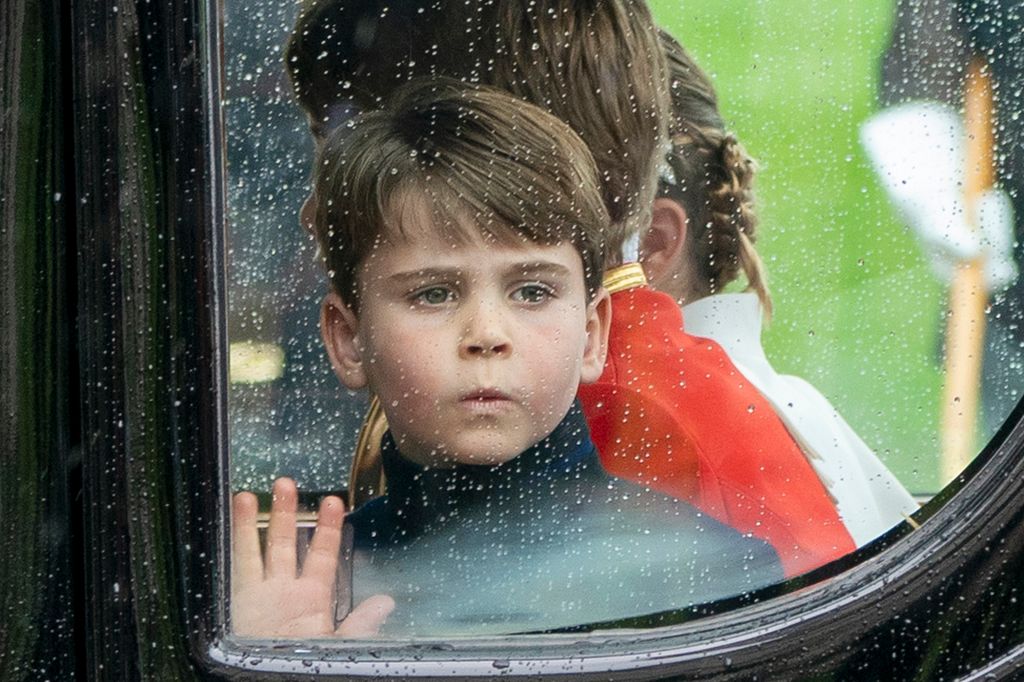 Prince Louis looking shocked as he puts his hand against the carriage window