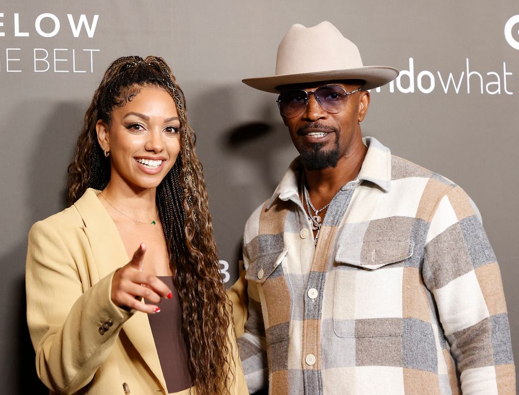 US actor Jamie Foxx  (R) and his daughter US producer Corinne Foxx arrive for the Los Angeles premiere of "Below the Belt" at the Directors Guild of America in Los Angeles, October 1, 2022. (Photo by Michael Tran / AFP) (Photo by MICHAEL TRAN/AFP via Getty Images)