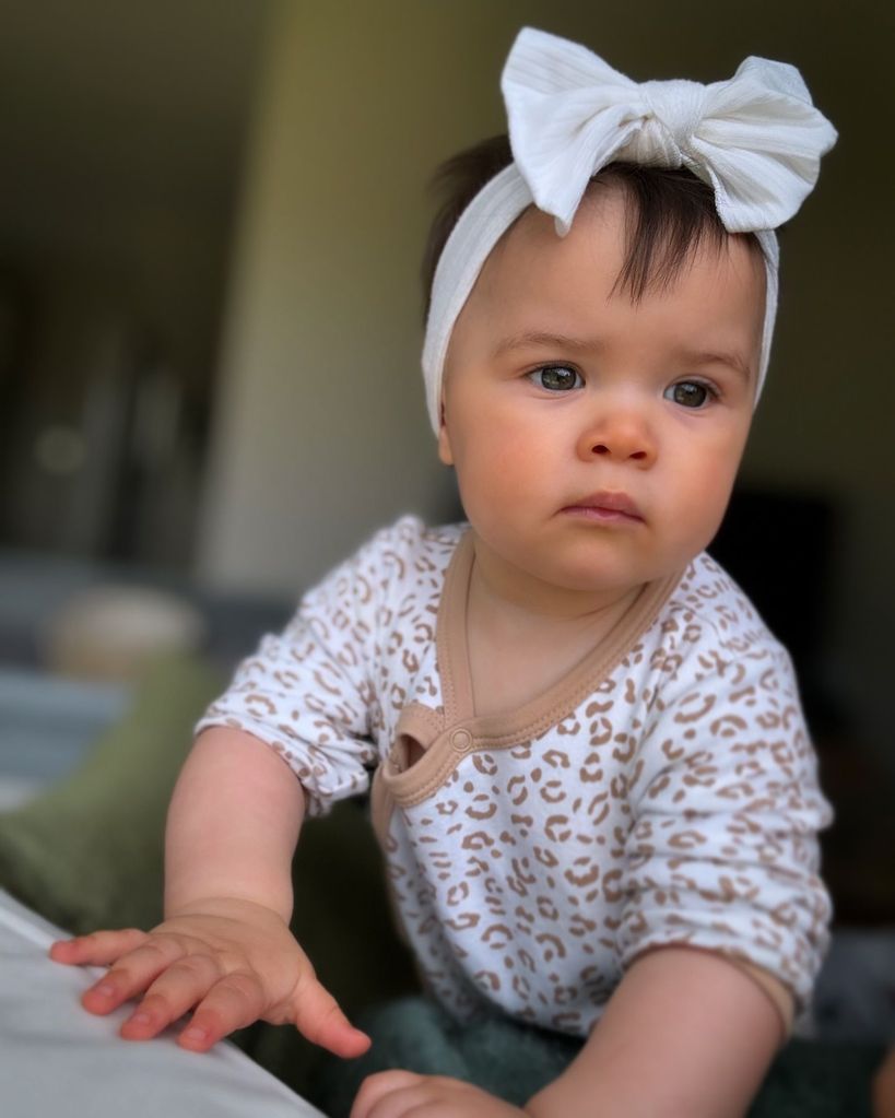 baby girl wearing white hair bow