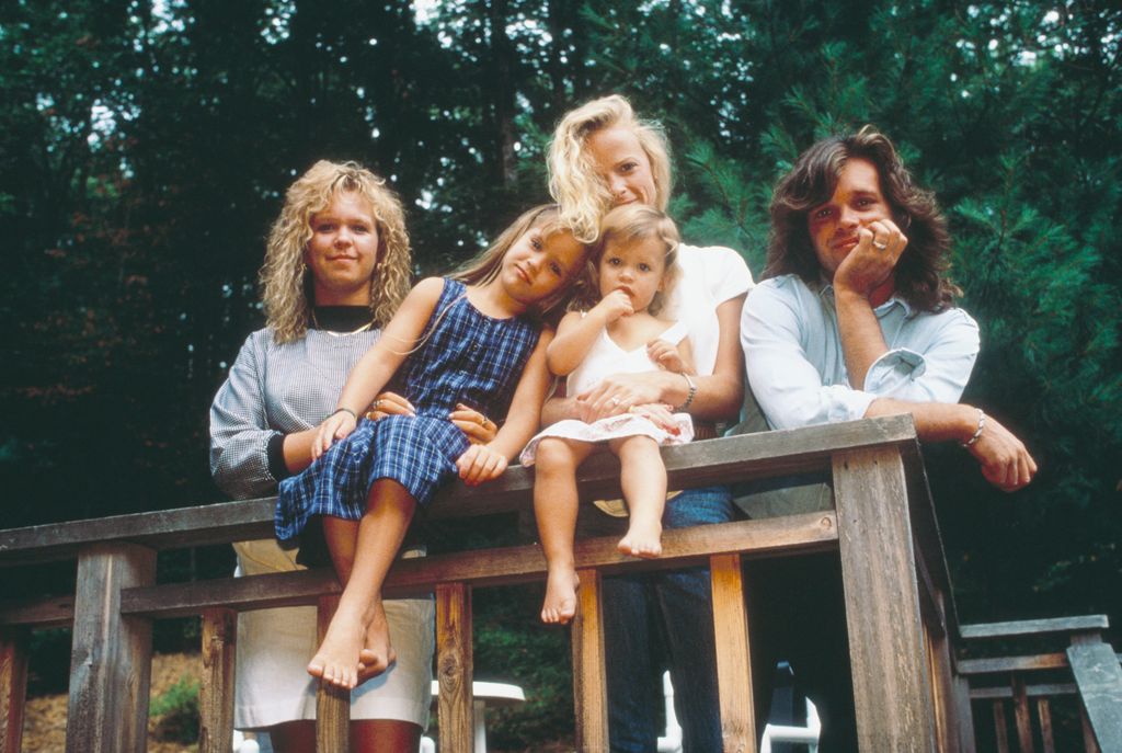 John Cougar Mellencamp (RIGHT)poses with his daughters (left to right) Michele, Teddi Jo, and Justice, and his wife, Victoria (C)