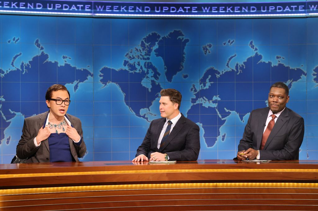 Bowen Yang as George Santos, anchor Colin Jost, and anchor Michael Che during Weekend Update on Saturday, November 1, 2025