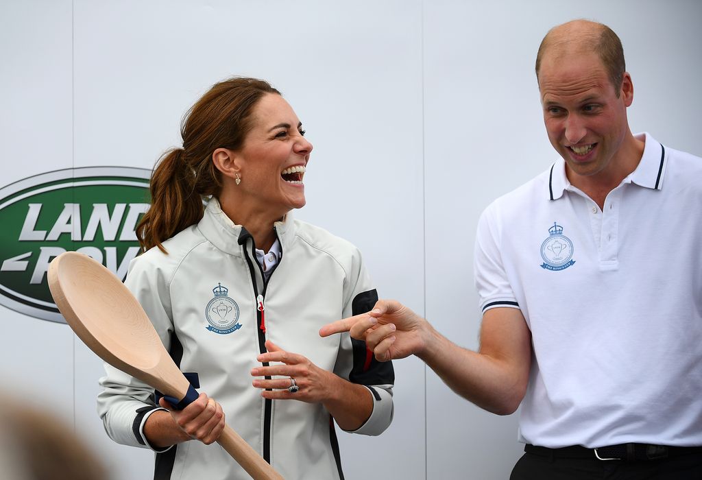 Kate Middleton laughing as she's awarded wooden spoon at sailing regatta