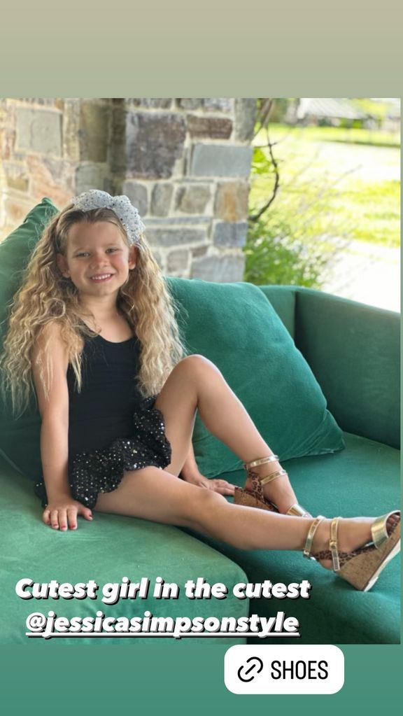 Jessica Simpson's daughter Birdie in wedges on a sofa