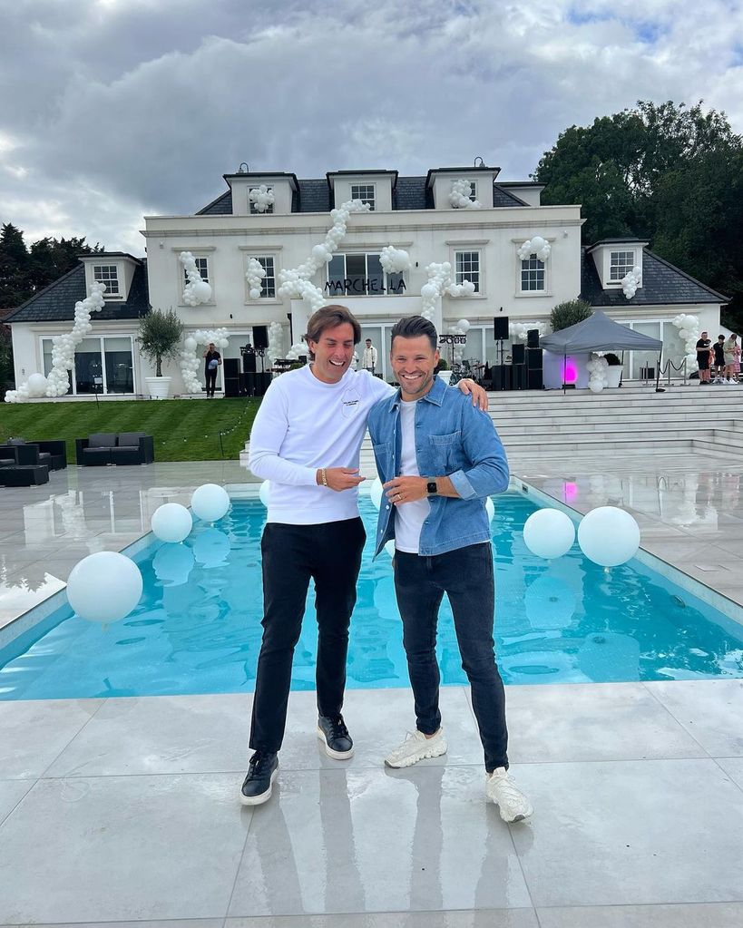 James Arg Argent posing with Mark Wright in front of Essex mansion