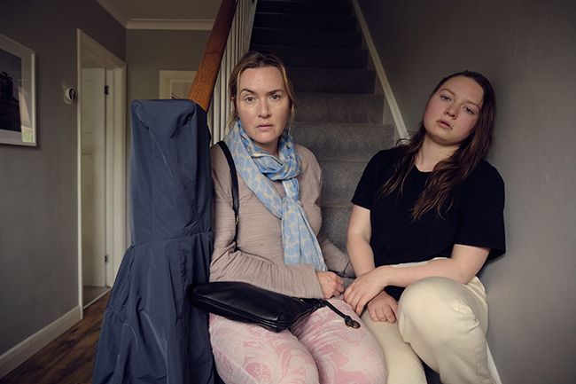 Kate and Mia sit on stairs for I Am Ruth
