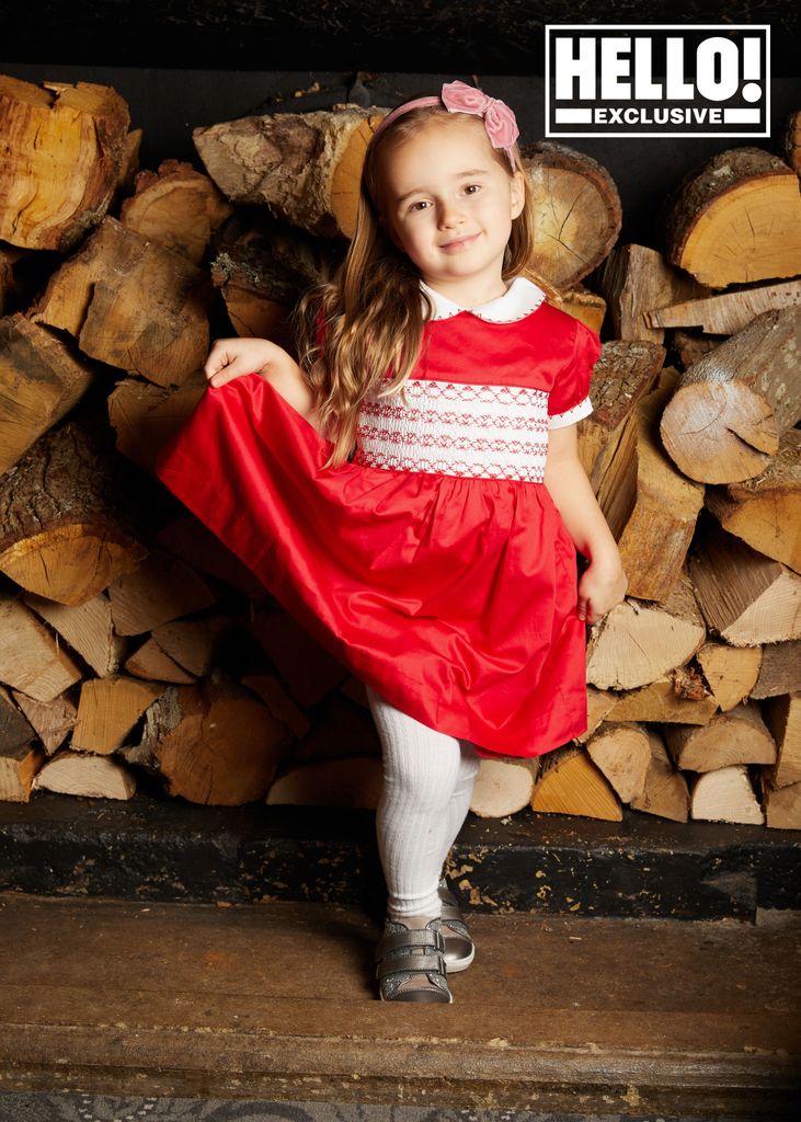 Ella Jordan wearing sweet red dress with white tights and collar