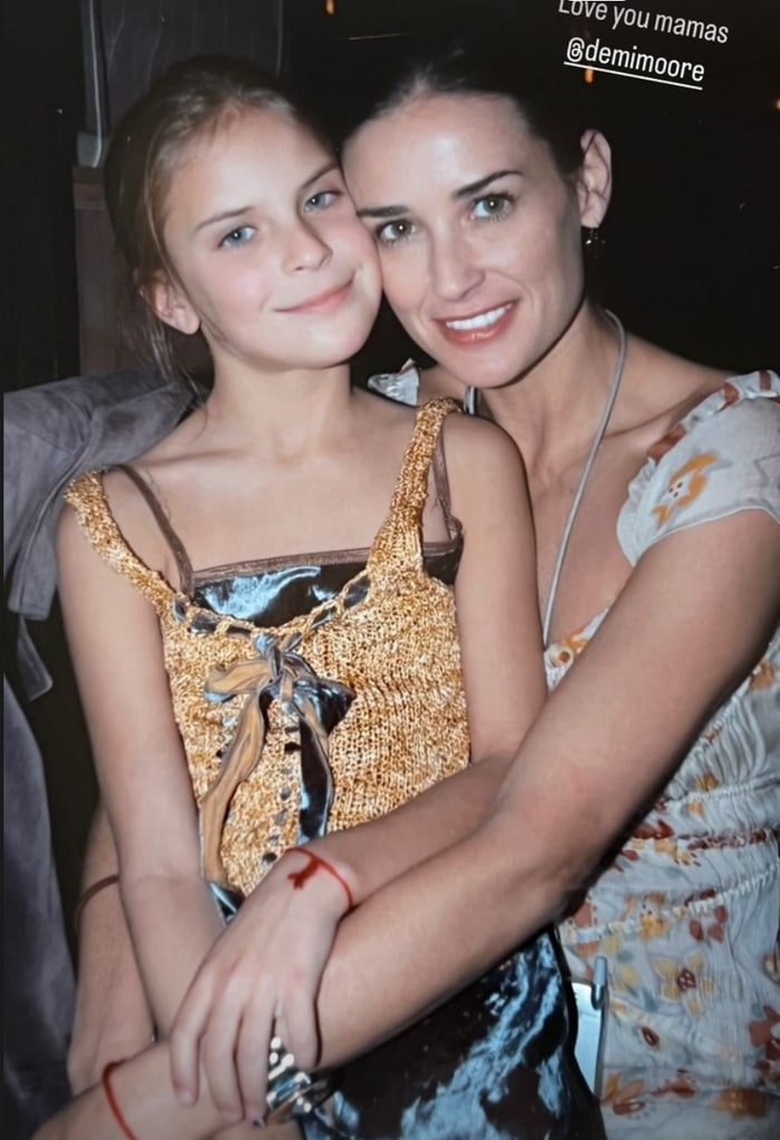 Throwback photo shared by Tallulah Willis on her Instagram Story October 24, 2023, where she is around ten or so years old, sitting on her mom Demi Moore's lap.