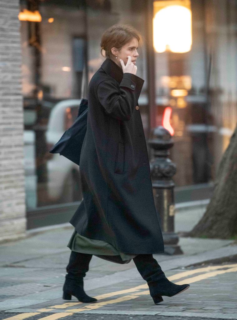 Princess Eugenie walking down a street