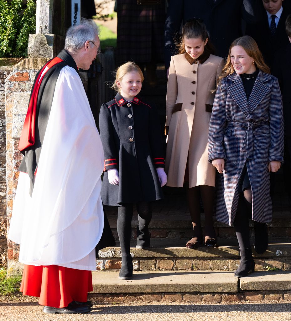 Lena Tindall leaving church with Princess Charlotte and her sister Mia Tindall with vicar looking on