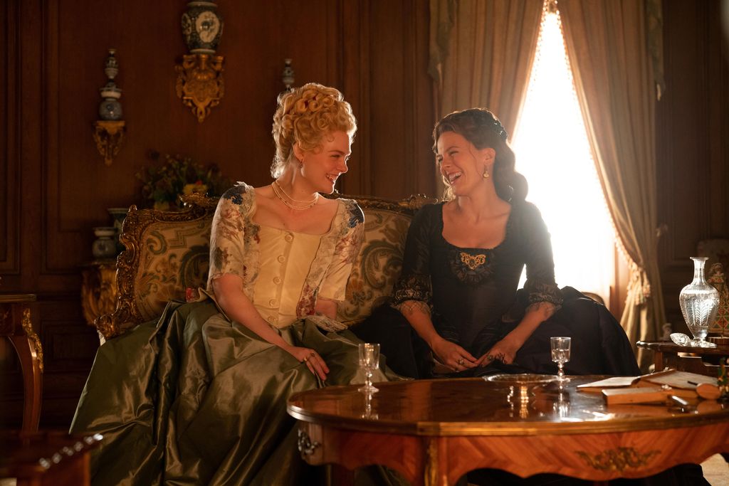Elle Fanning as Catherine and Phoebe Fox as Marial in The Great