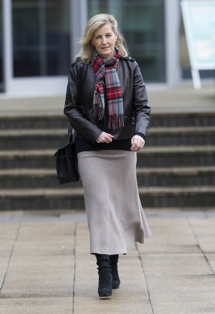 Sophie in leather jacket with tartan scarf