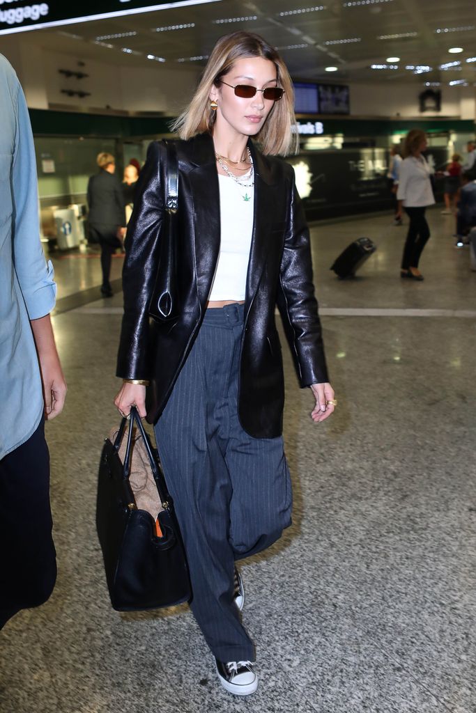 Bella Hadid wears a leather blazer to arrive at Milan Fashion Week 