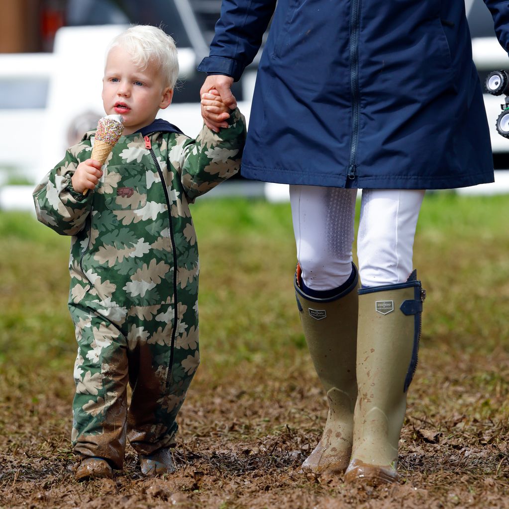 Lucas Tindall seen eating an ice cream as he and his mother Zara Tindall attend day 2 of the 2023 Festival of British Eventing at Gatcombe Park 