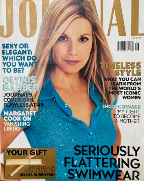 Magazine cover with woman in blue top