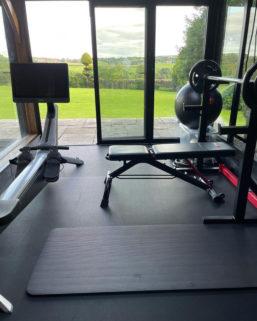Gym equipment in a room looking out onto the countryside