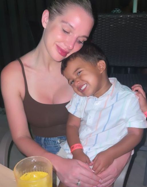 Helen Flanagan in brown top with young son