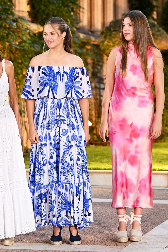 Princess Leonor in blue dress and Sofia in pink tie-dye dress