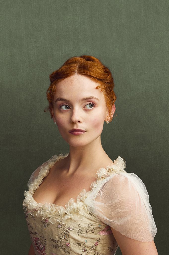 close-up woman with ginger hair in white dress