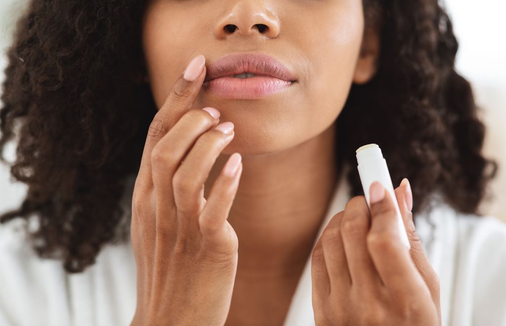 Applying lip balm regularly helps protect the area