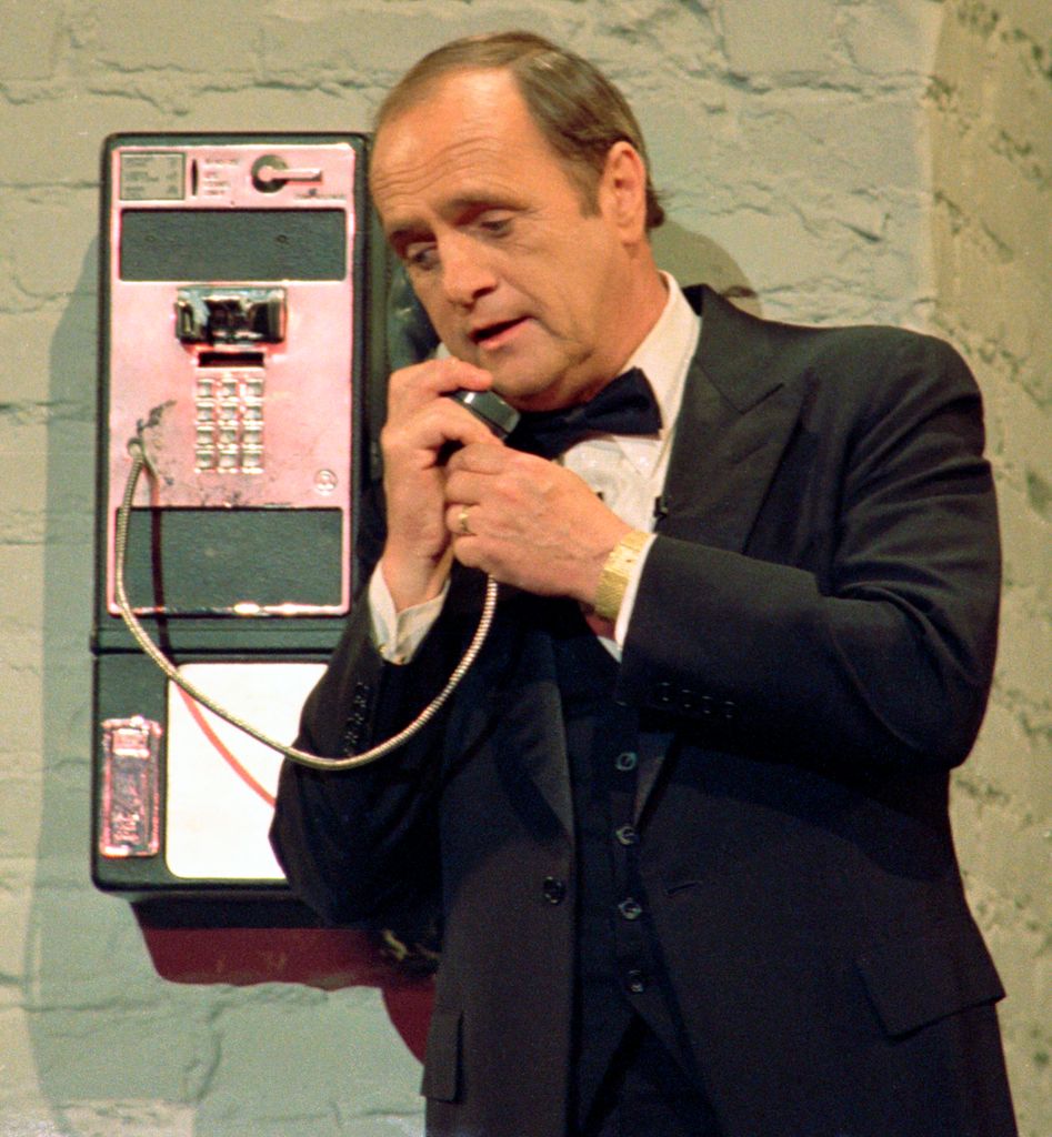 Bob Newhart talks on a pay telephone during 'Hollywood 100th Birthday' celebration, April 26, 1987
