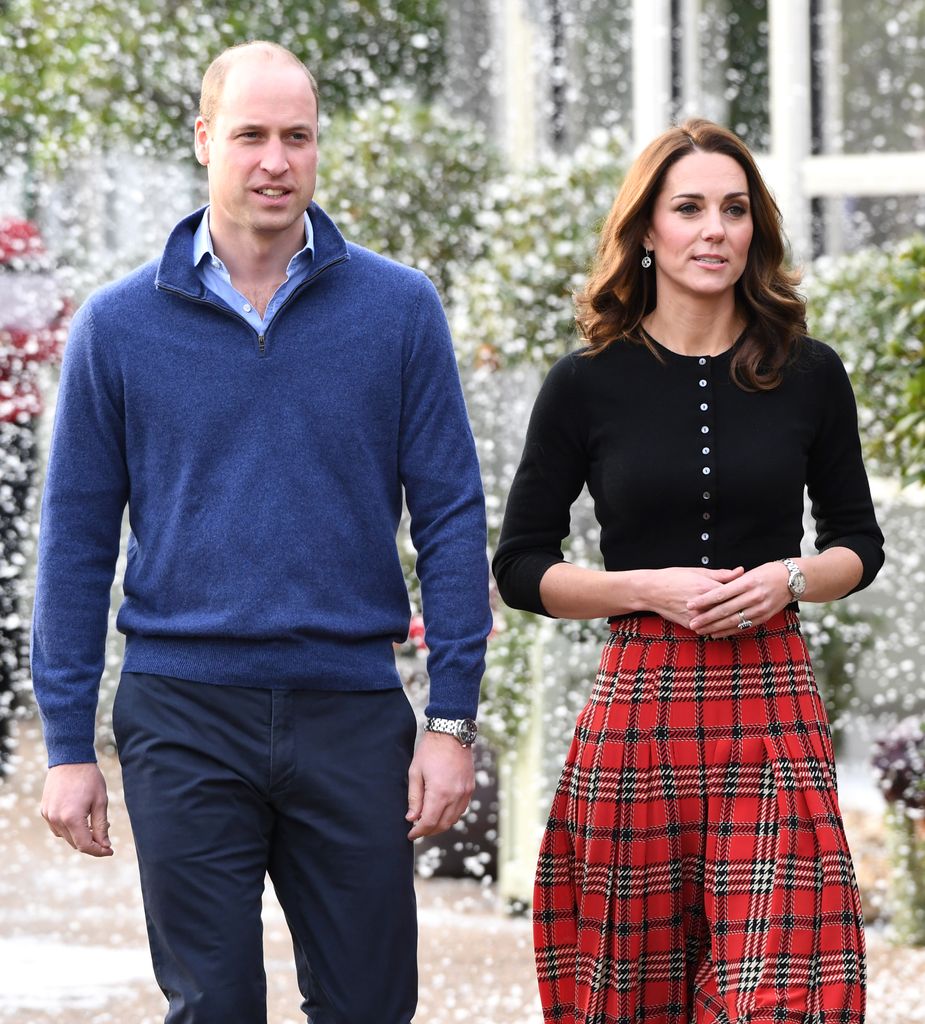 Prince William and Kate walking whilst fake snow falls around them