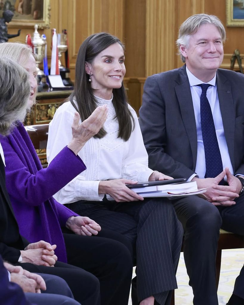 woman sat down with man in suit