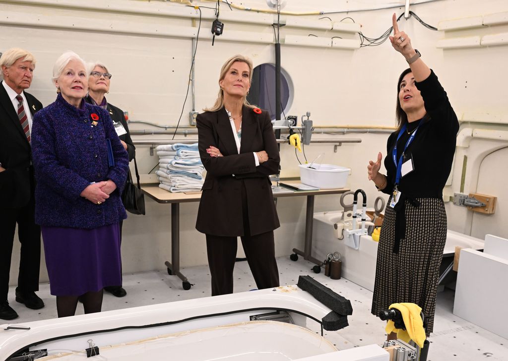 Duchess of Edinburgh wears brown suit at Toronto Rehabilitation Institute, Canada