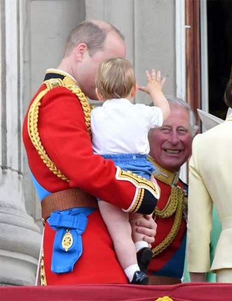 Prince Charles smiles at baby Prince Louis in 2019