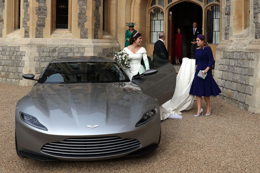 Beatrice helping Eugenie get into her car on wedding day