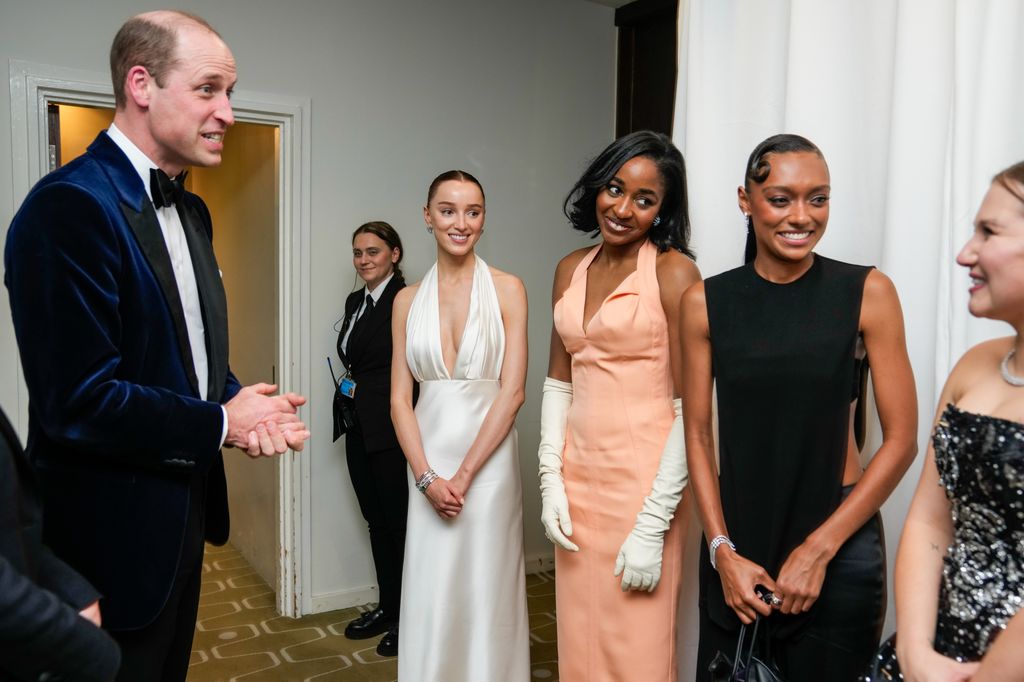 Prince William, Prince of Wales meets Phoebe Dynevor, Ayo Edebiri, Sophie Wilde and Mia Mckenna-Bruce, winner of the EE Rising Star Award, backstage during the EE BAFTA Film Awards 2024 at The Royal Festival Hall 