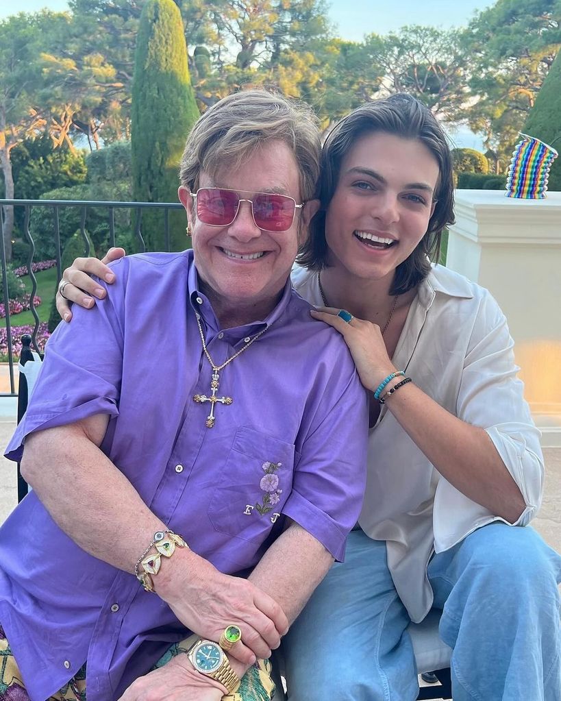 A photo of Elton John smiling with Damian Hurley