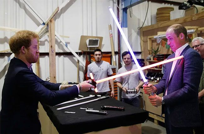 Prince Harry and Prince William duel with light sabres