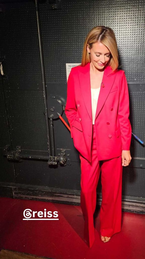 Cat Deeley wearing a red suit from Reiss on This Morning