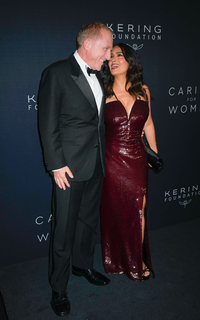 Francois-Henri Pinault and Salma Hayek laughing together on the red carpet