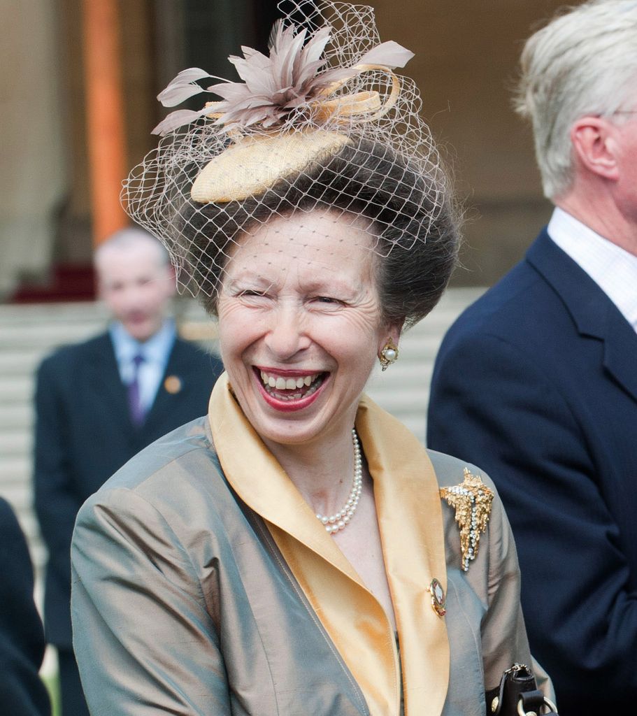Princess Anne wore her pearl earrings and striking gold brooch to the Buckingham Palace garden party in 2011