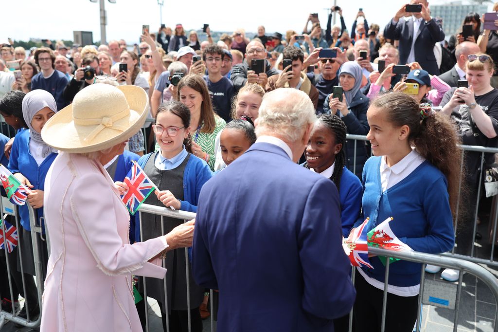King Charles III and Queen Camilla are greeted by community members outside the Senedd